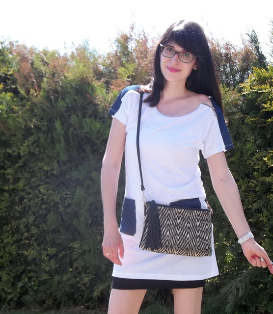 white tunic and black skirt