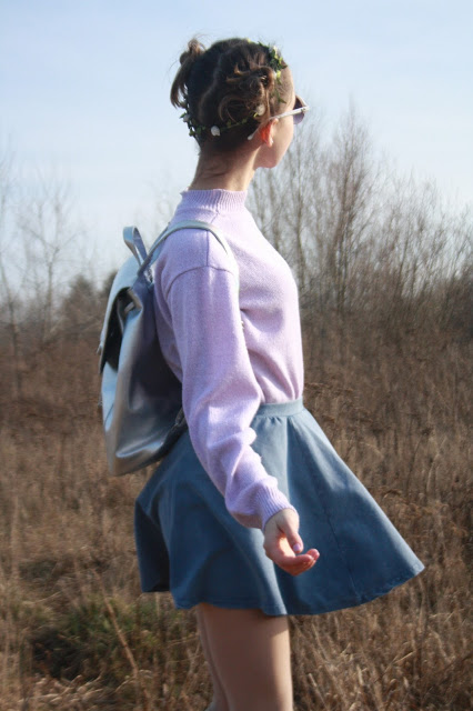 Child in a large lilac sweater